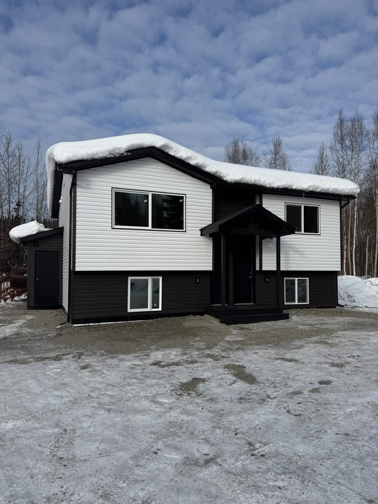 House after Golden Hammer renovation — fully renovated exterior with new roof and siding